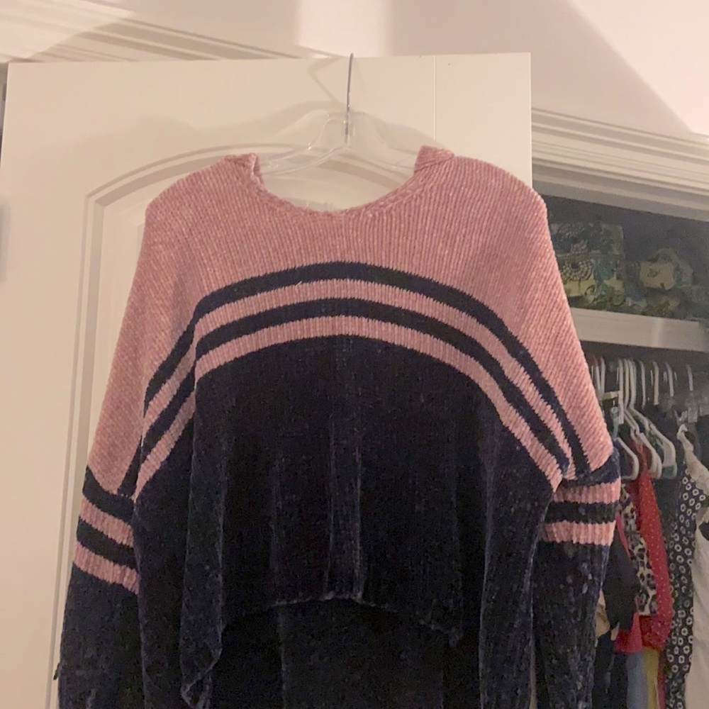 A navy and pink sweater/causal throw on top